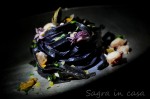 Homemade squid ink Tagliatelle served with sea food